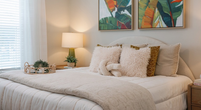 bedroom with bed end tables with lamps