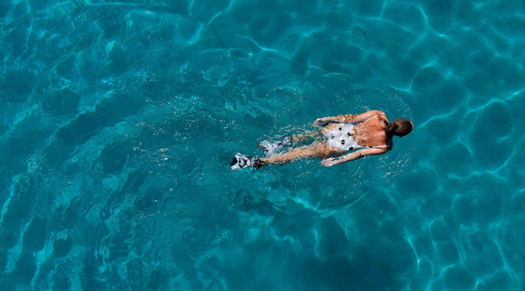 Sparkling swimming pool a person swimming in a pool